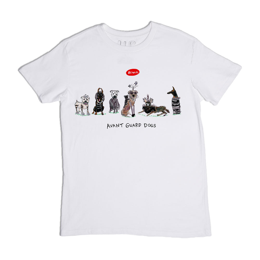 White t-shirt with a whimsical cartoon design featuring a row of various dogs dressed in quirky outfits under a banner titled "avant guard dogs." one dog has a speech bubble that says "fetch.