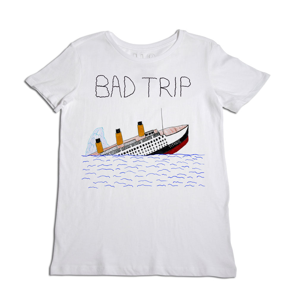 A white t-shirt with an illustration of a sinking ship and the phrase "bad trip" drawn above in rough, hand-drawn letters. the ship is depicted tilting in water with smoke coming out of its funnels.