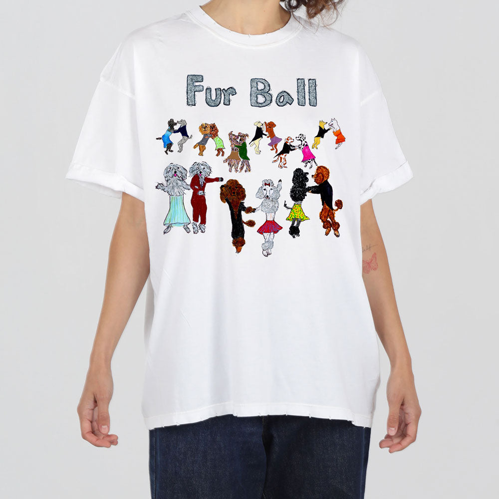 A person wearing a white t-shirt with colorful illustrations of various stylized dogs in fashionable outfits, labeled "fur ball.