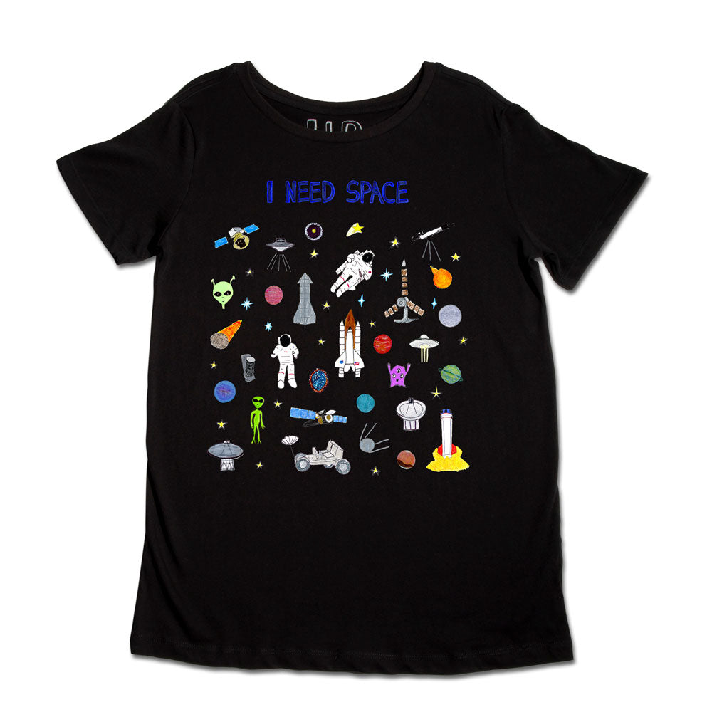 A black t-shirt with the phrase "i need space" at the top. the shirt is decorated with colorful embroidered patches including planets, astronauts, spaceships, and stars.