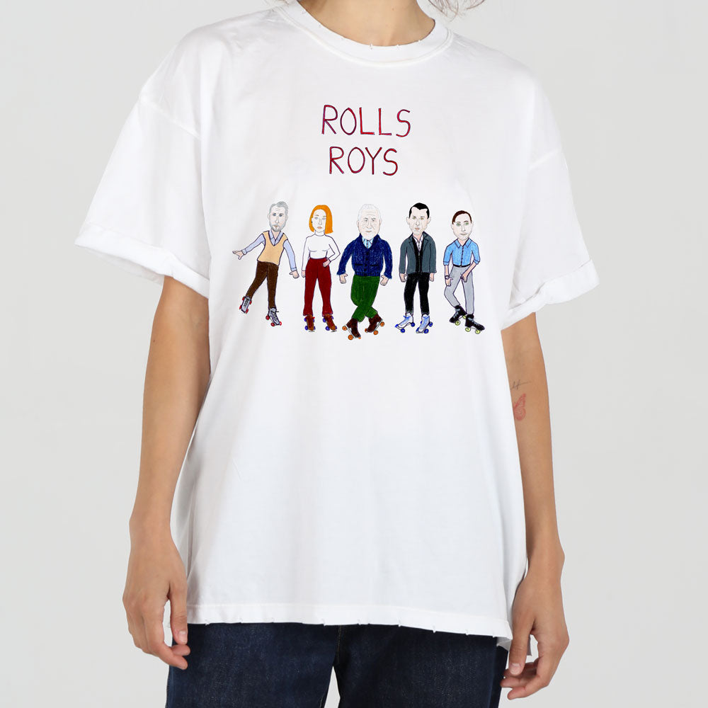 A person wearing a white t-shirt featuring a playful graphic of six cartoonish figures styled in various colorful outfits, under the phrase "rolls roys" in red letters.