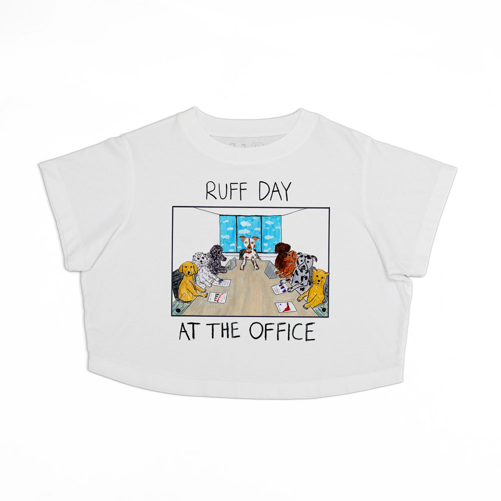 White crop top with a cartoon design featuring four dogs of different breeds playing poker at a table, with cards and chips scattered about. text above reads "ruff day" and below "at the office.
