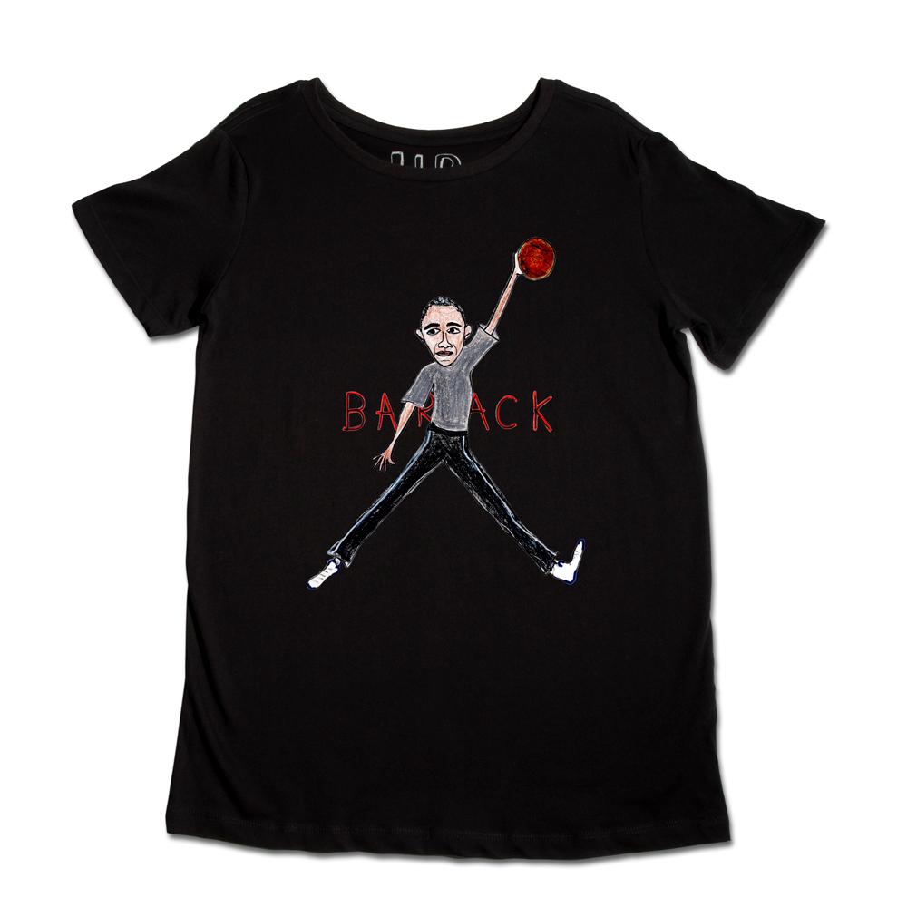 Black t-shirt with a graphic design of a cartoon figure holding a microphone, mid-jump, with "backtrack" text below the image.