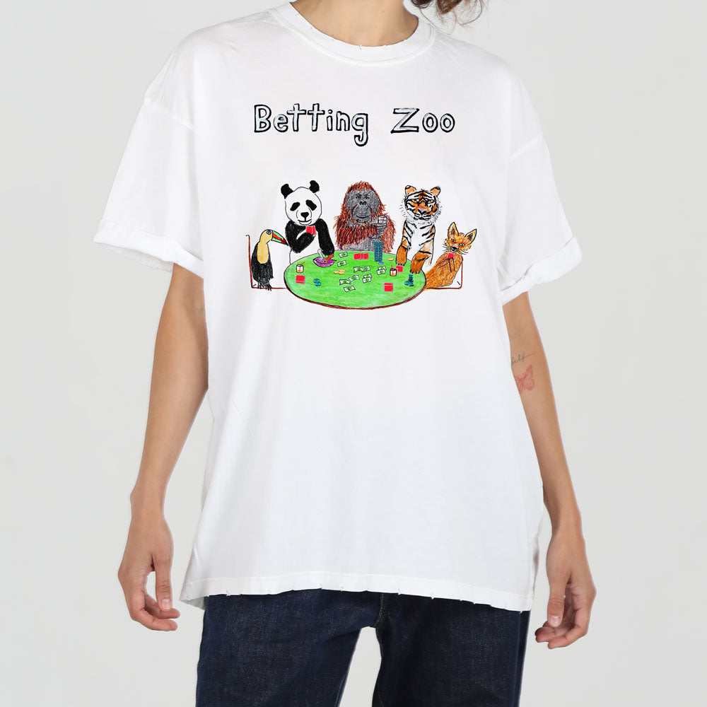 A person wearing a white t-shirt with a colorful graphic of a panda, tiger, and other animals playing poker at a green table, titled "betting zoo.