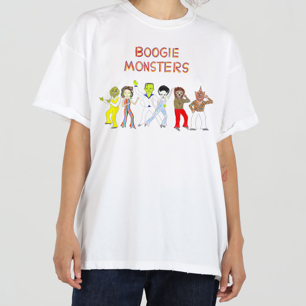 A person wearing a white t-shirt featuring colorful cartoon characters labeled "boogie monsters," styled as various funky monsters in a dance pose.