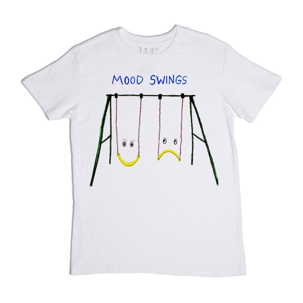 A white t-shirt featuring a graphic of two swing sets with faces; one swing has a happy face and the other has a sad face, labeled "mood swings" in blue text above.