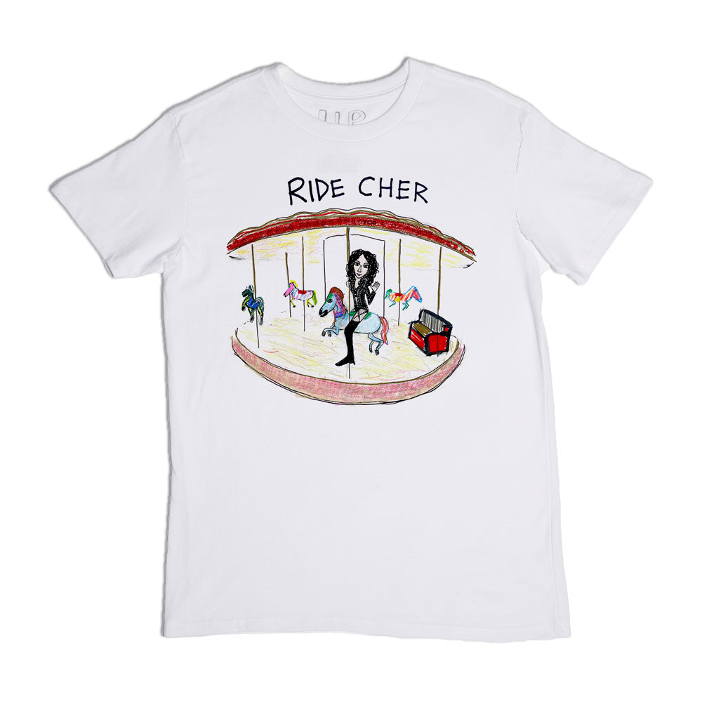 White t-shirt featuring a colorful illustration of a carousel with a central figure reminiscent of cher, surrounded by horses and the text "ride cher" at the top.