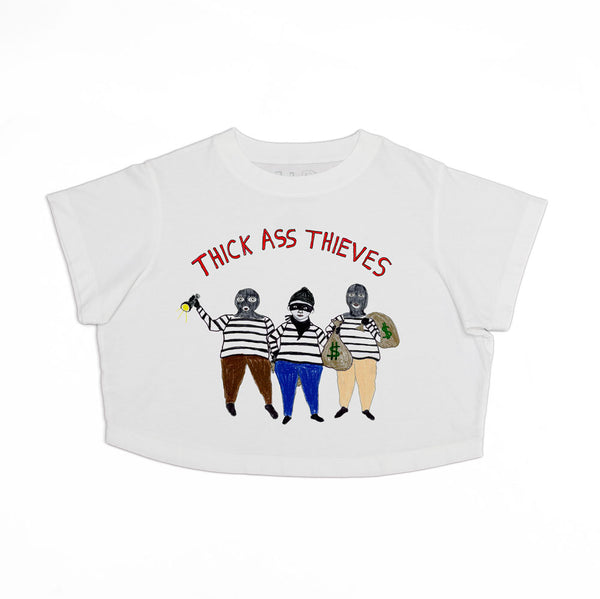 White T-shirt with an illustration of three cartoon bandits wearing stripes and masks, holding a flashlight and money bag. The text above them reads "THICK ASS THIEVES" in red letters.