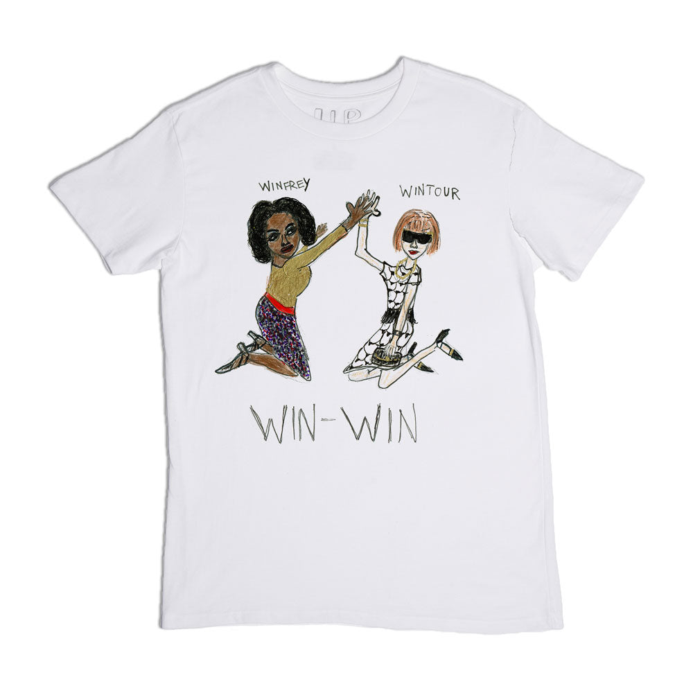 White t-shirt with an illustration of two animated women, one in a yellow top and striped skirt, the other in a patterned dress, both riding skateboards, captioned "win-win.