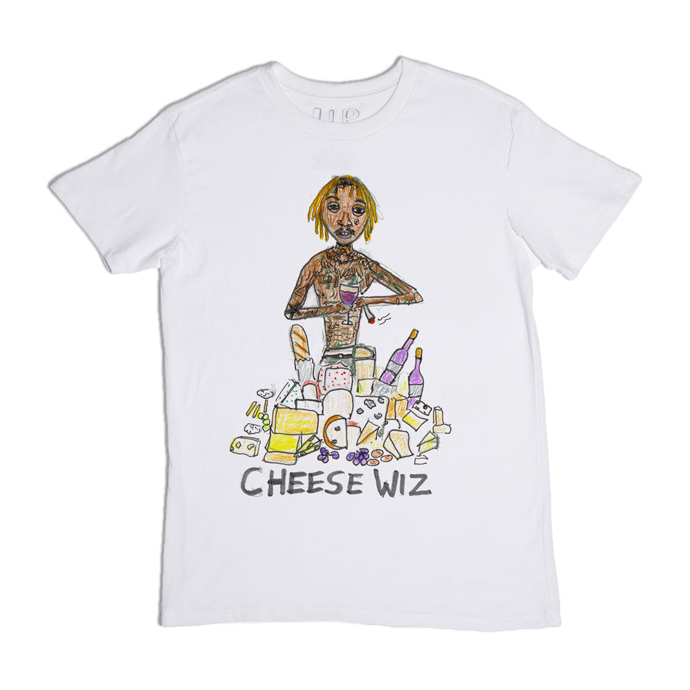 A white t-shirt featuring a colorful cartoon-style illustration of a young woman surrounded by various cheese products, with the phrase "cheese wiz" printed at the bottom.