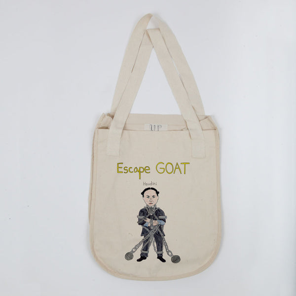 A beige tote bag featuring an illustration of a person in a straitjacket and chains with the words "Escape GOAT" and "Houdini" above the image.