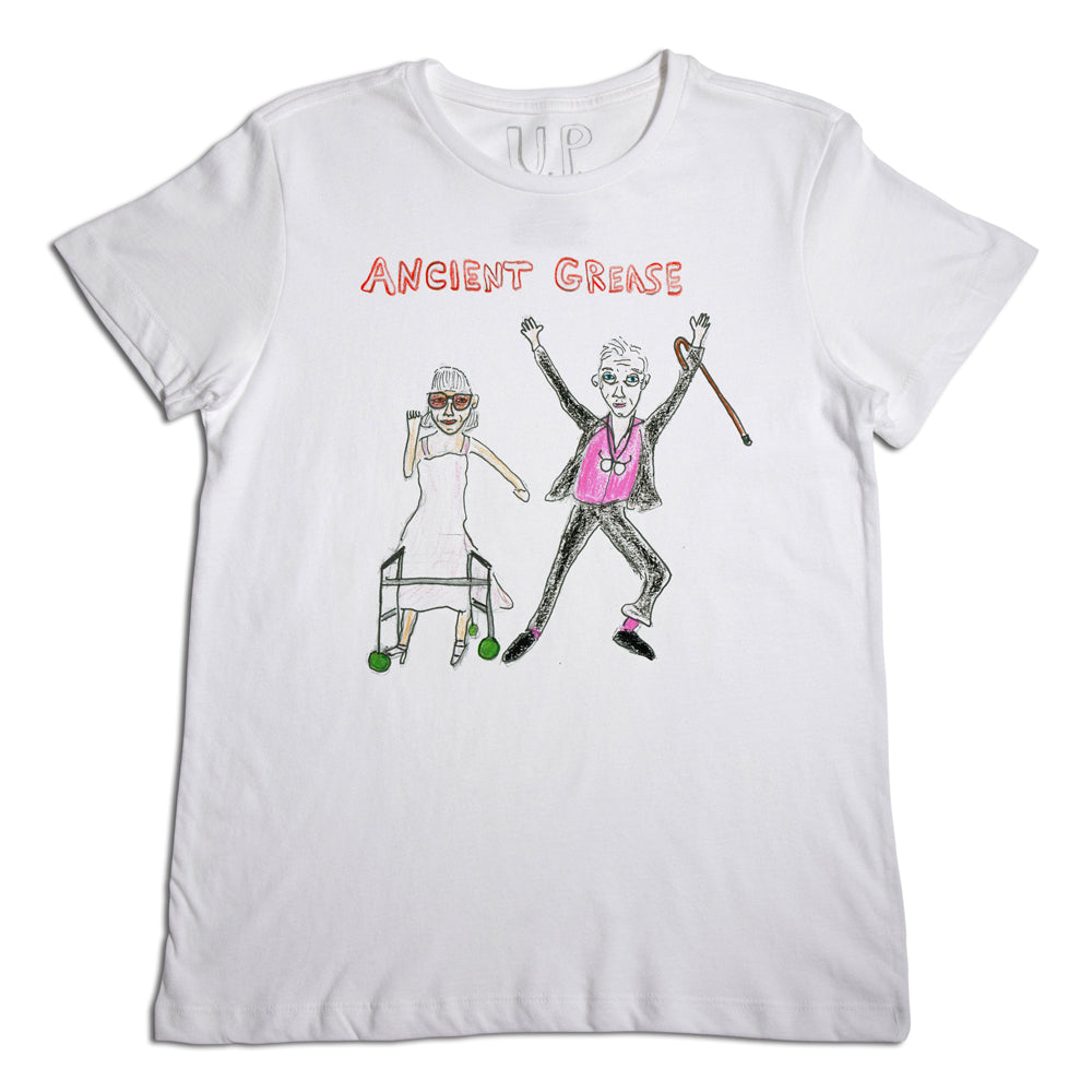 White t-shirt with a humorous design titled "ancient grease," featuring drawings of two elderly figures dancing, one with a cane and the other with a walker, parodying the movie "grease.