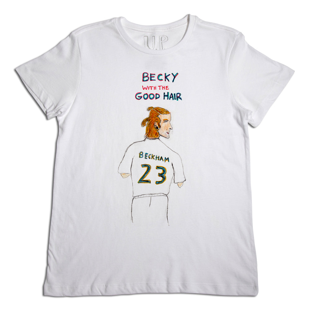 A white t-shirt featuring a hand-drawn illustration of a man with reddish blonde hair from behind, wearing a jersey labeled "beckham 23". above the image is the text "up with the good hair.
