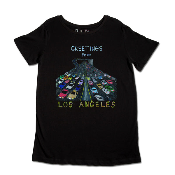 A black t-shirt featuring a graphic of congested colorful cars arranged in a peacock tail design, with text saying "greetings from los angeles" above the design.