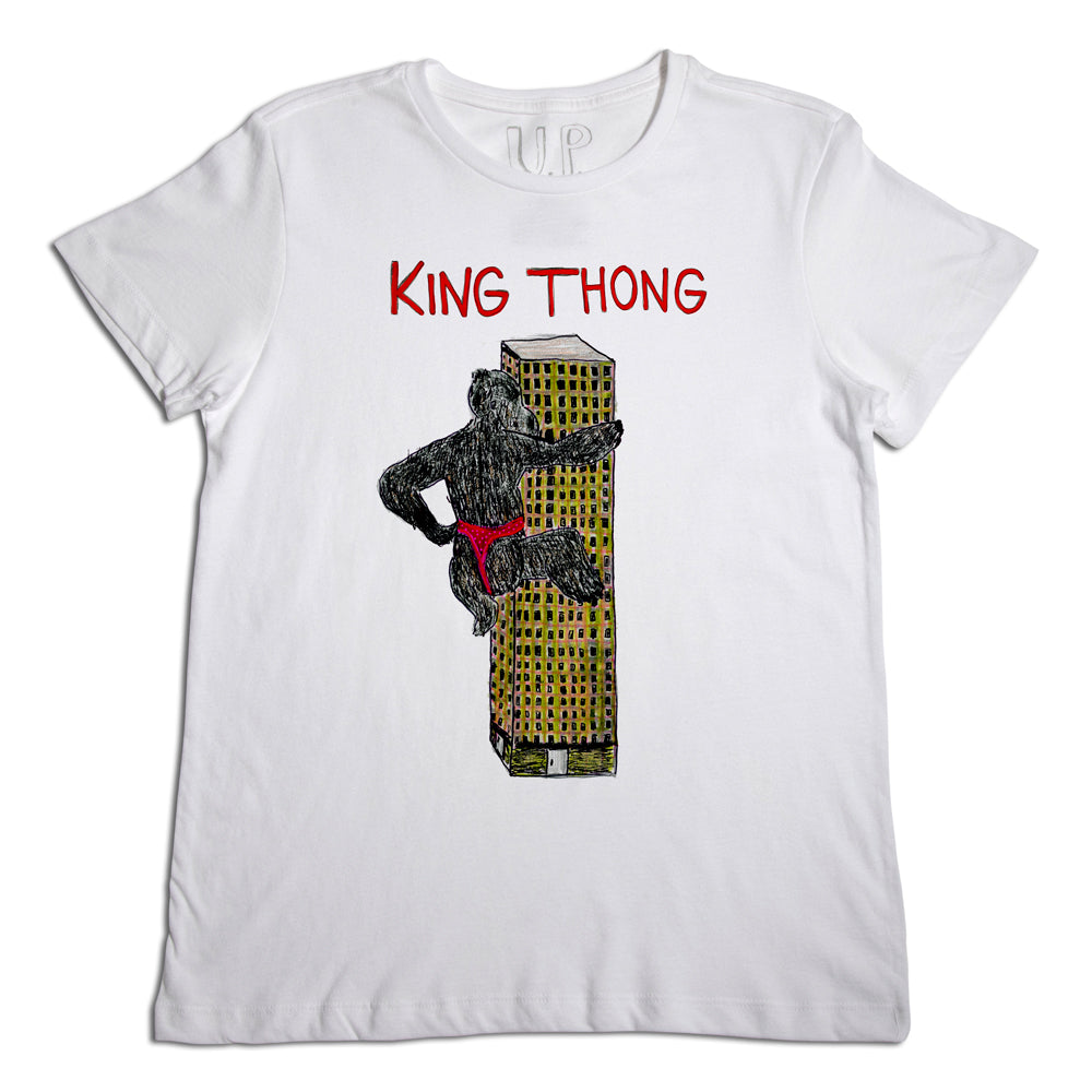 White t-shirt featuring a humorous graphic that depicts a skyscraper dressed in a red thong, labelled "king thong." the illustration combines urban and playful elements in a standout design.