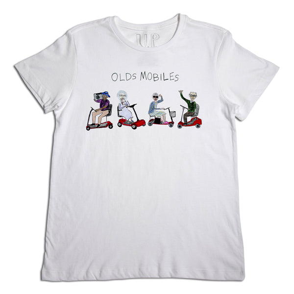 A white t-shirt featuring a graphic of five elderly women riding red scooters in a row, with the text "olds mobiles" printed above in black.