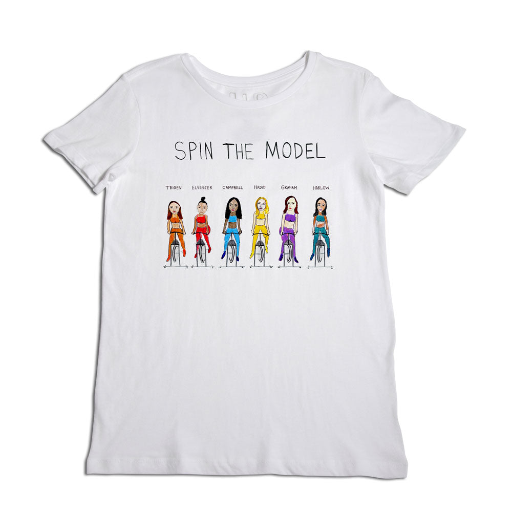 White t-shirt with the phrase "spin the model" above a lineup of cartoon-style female figures in various fashion styles, indicating customizable outfit choices.