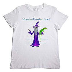 A white t-shirt featuring a colorful drawing of a wizard in a purple robe holding a wand and a green lizard, with the text "wizard in a blizzard with a lizard" above.