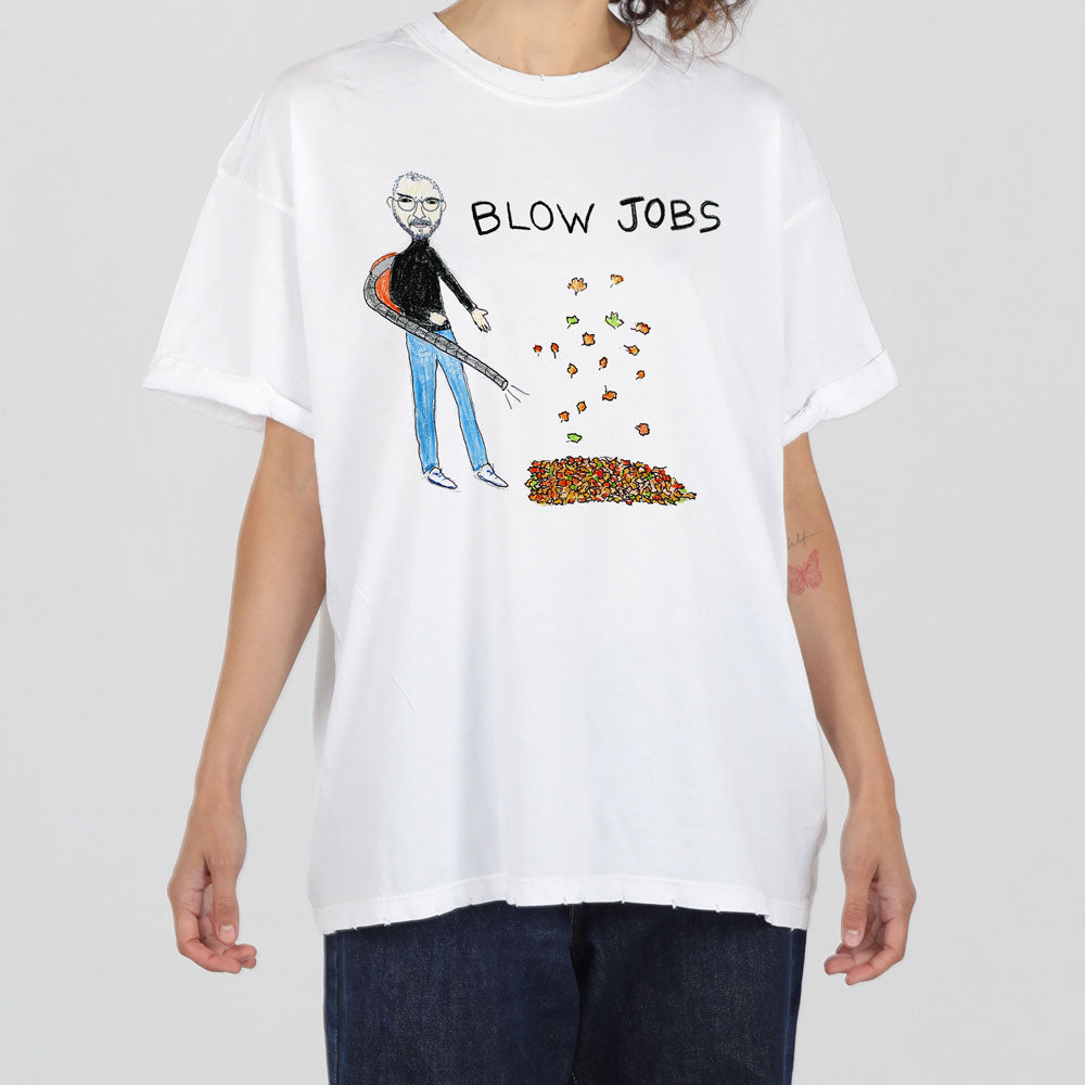A person wearing a white t-shirt with a graphic design featuring a caricature of steve jobs blowing autumn leaves, under the caption "blow jobs".
