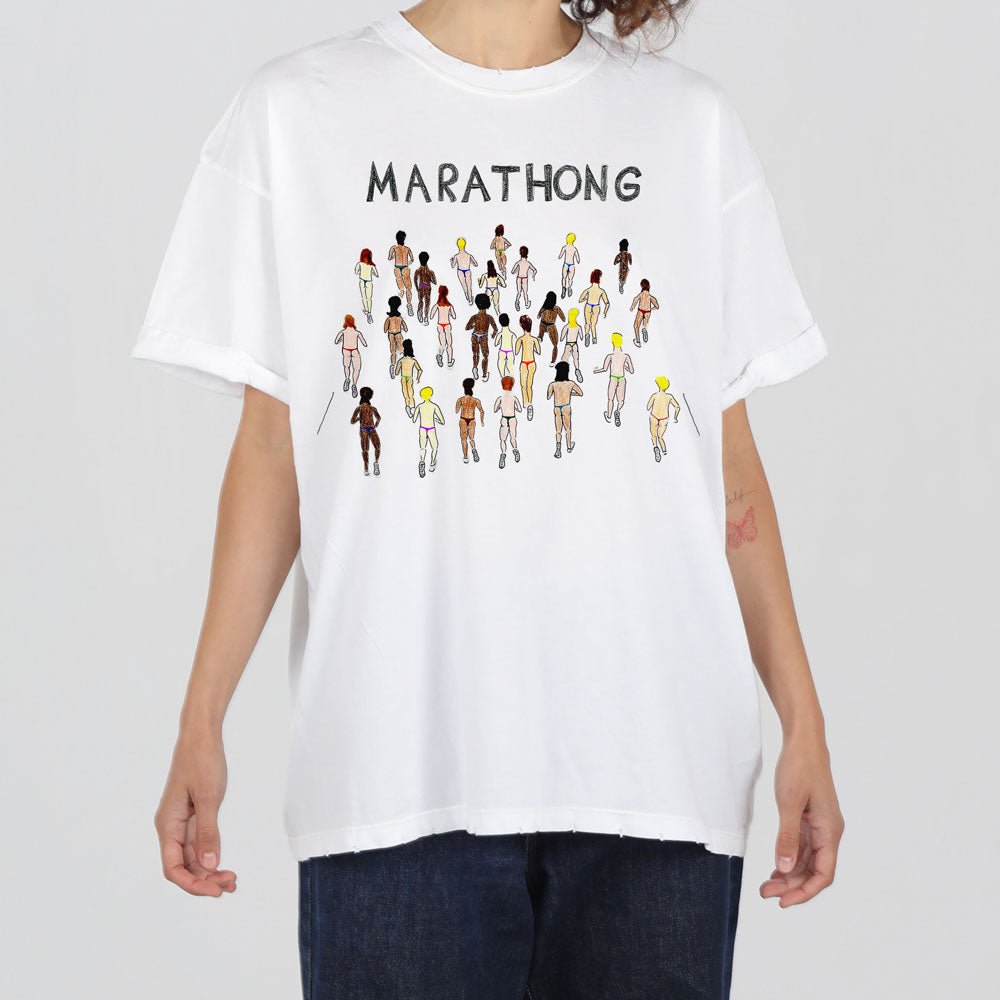 A person in a white t-shirt with the word "marathong" printed above diverse cartoon-style runners spanning the chest area. the shirt has a relaxed fit and basic crew neckline.