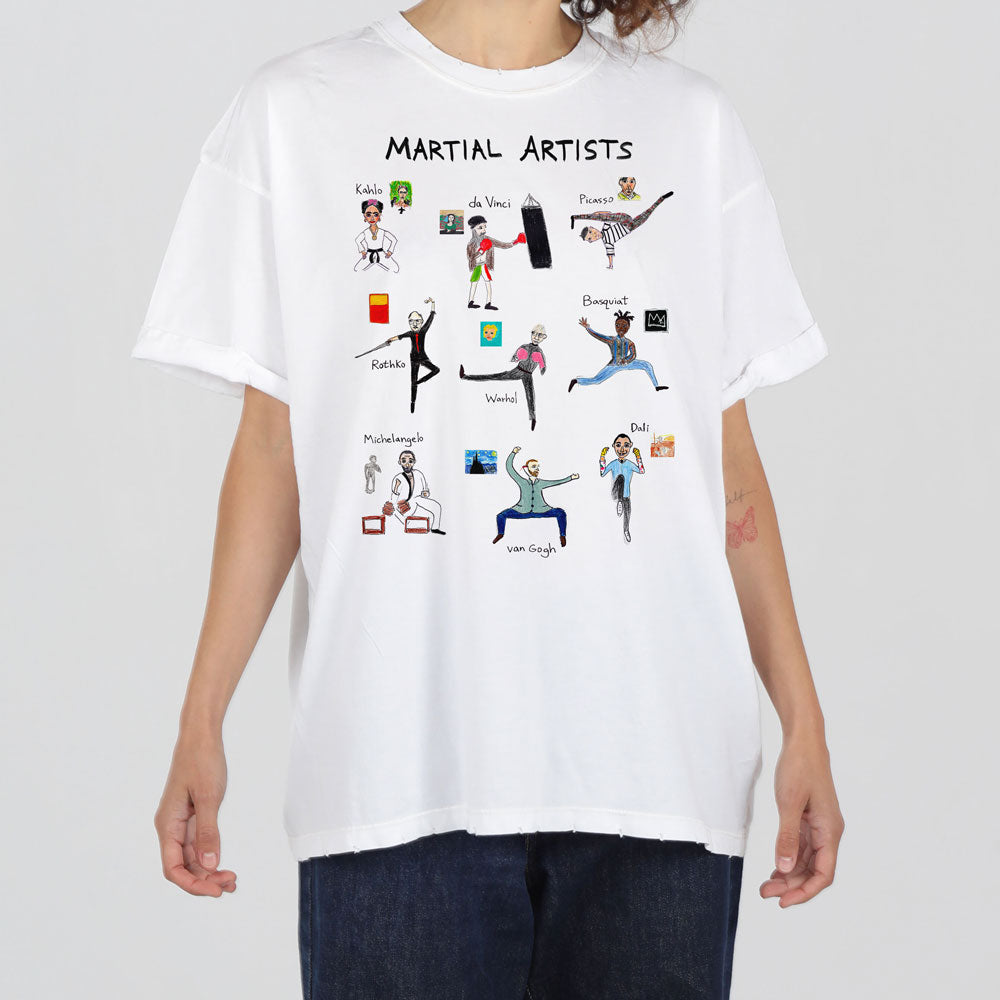 A person wearing a white t-shirt with "martial artists" printed on it, depicting cartoon figures of famous artists like da vinci and van gogh, humorously shown as martial artists.